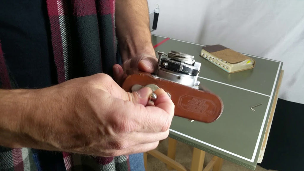 Unboxed "camera belt button" / camera belt hanger by Hydn Images (2 years ago)